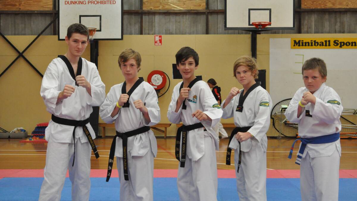 FIGHT READY: Eclipse Taekwondo members Daniel O’Driscoll from Bomaderry, Tim Parks from Falls Creek, Jake Evans from Shoalhaven Heads, Dylan Abbott from Bomaderry and Jack Haworth from Sanctuary Point at the third South Coast Open on the weekend.
