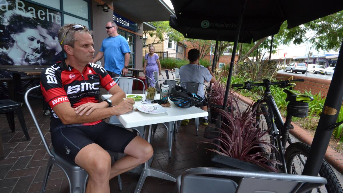 OUTLOOK: Chris King from Nowra Hill prefers to sit outside for a coffee on a nice day. He makes use of cafes that offer alfresco.