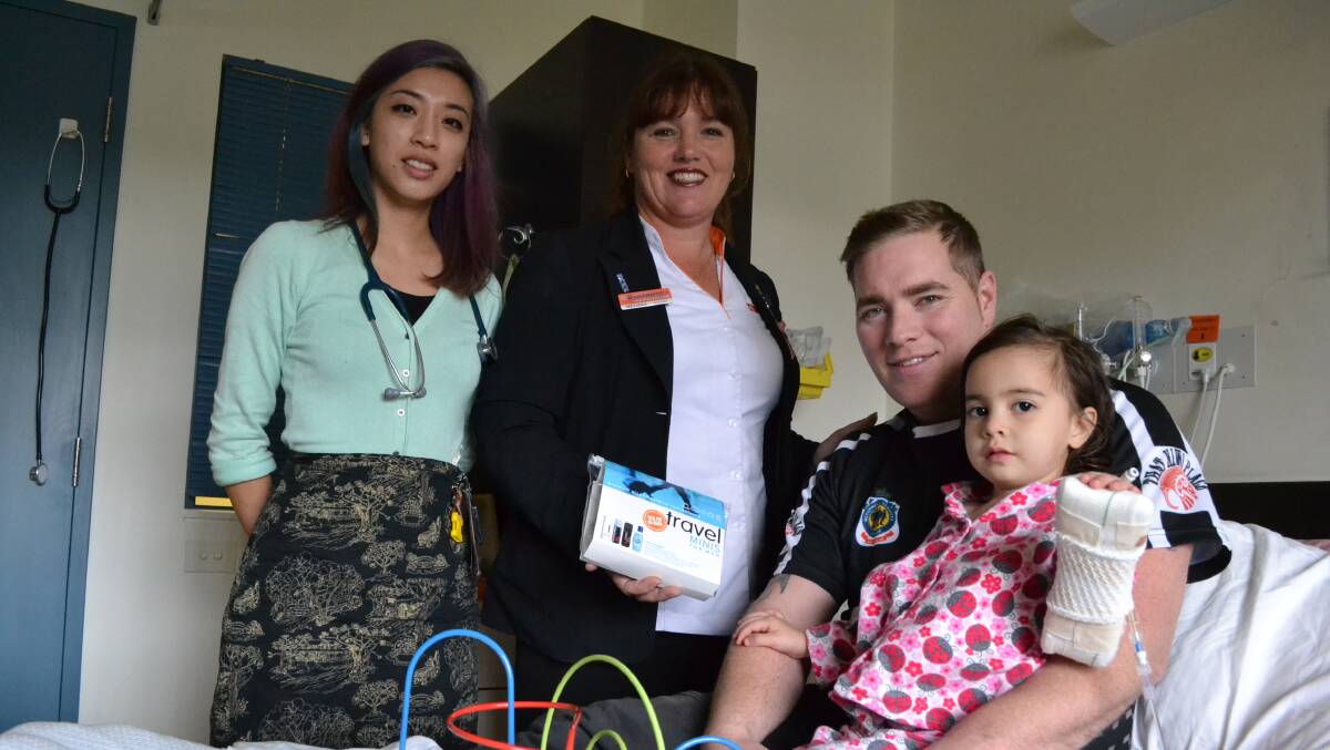 FEELING FRESH: Doctor Denise Nguyen, Melissa Lewington from Good Price Pharmacy Warehouse, Brad Sutherland and his daughter Valentina in the Children’s Ward receive one of the donated parent’s packs to use while he stays at hospital to care for his loved one.