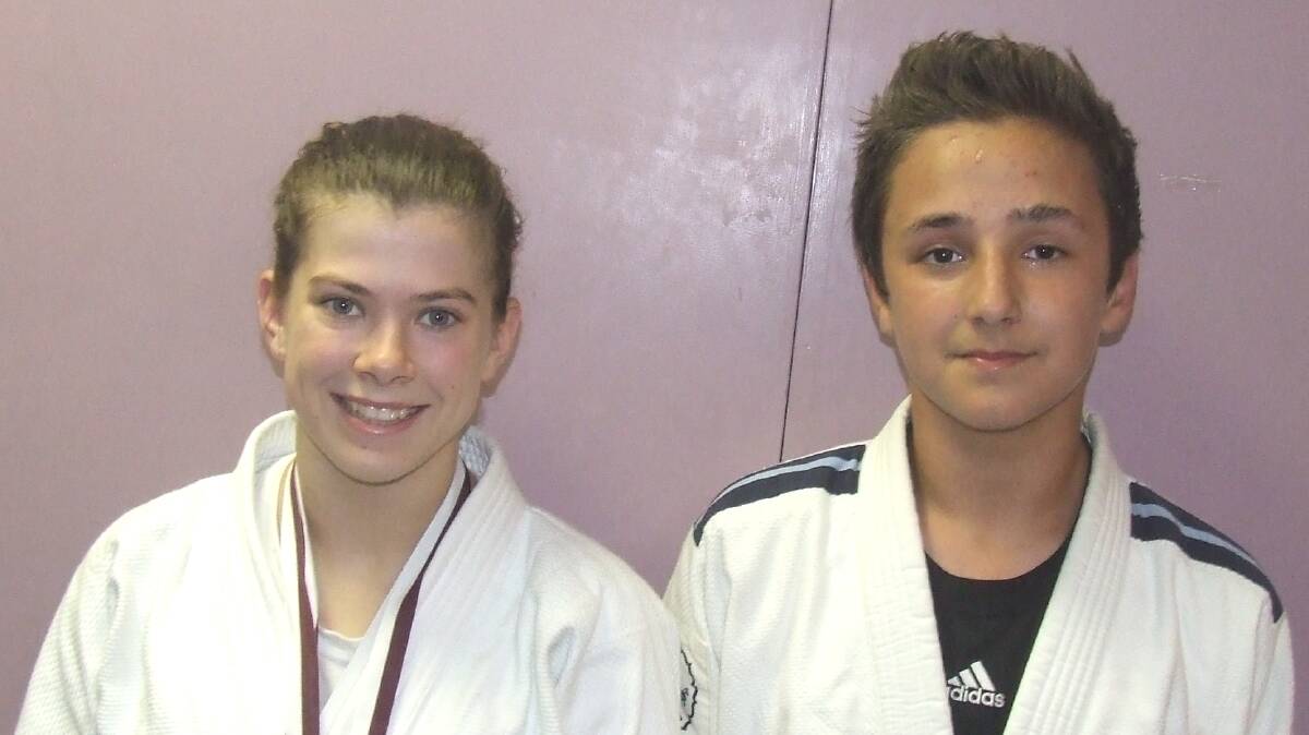 INTERNATIONAL SUCCESS: Shoalhaven Heads Bushido Judo Club members Tinka Easton and Dario Simic with their medals they won from a recent international tournament in Queensland. 