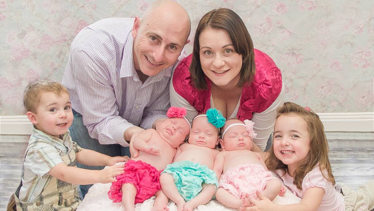 HIGH FIVE: Former Nowra residents Peter, Paul, Star-Jade and Amelia Reed from Picton have their hands full with the addition of five-month-old triplets Evie, Isabelle and Sophia.