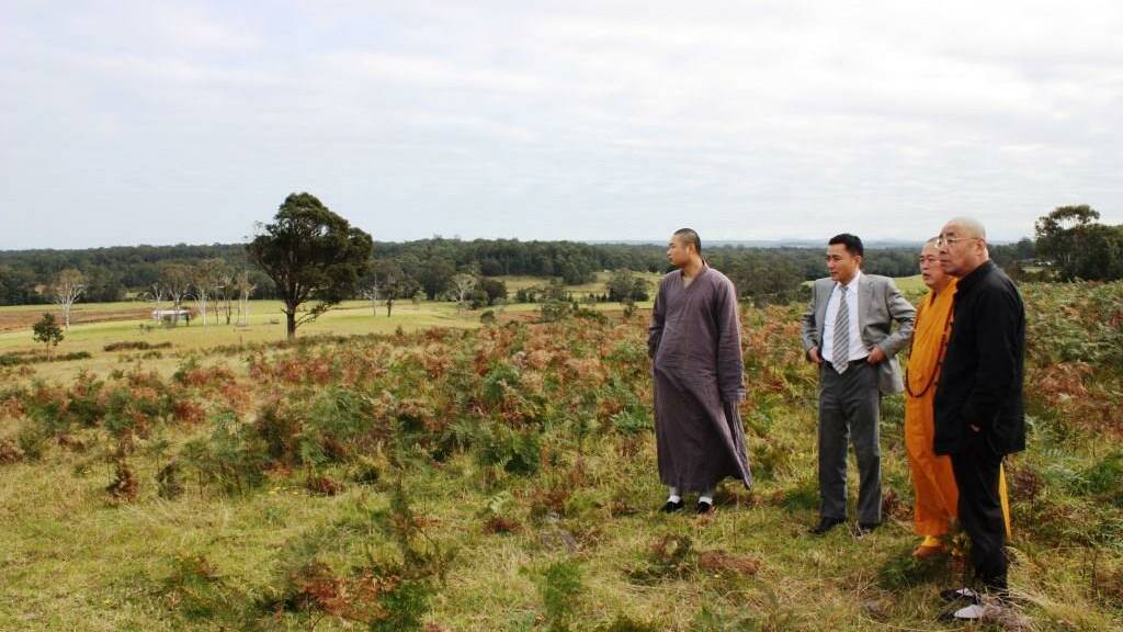 SITE INSPECTION: Abbot Shi Yongxin and his entourage tour the site of the Shaolin complex at Comberton Grange.