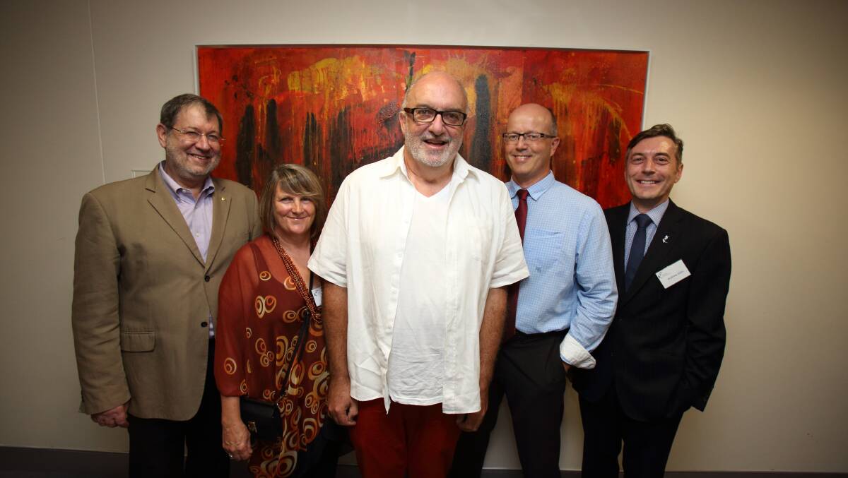 GIFT: Berry artist Bernard McGrath’s donation of his painting Firefighters is celebrated by Garvan Institute of Medical Research executive director/professor John Mattick, Liz McGrath, artist Bernard McGrath, Parkinson’s disease researcher associate professor Antony Cooper and Garvan Research Foundation chief executive officer Andrew Giles at the artwork’s unveiling at the institute in Sydney.
