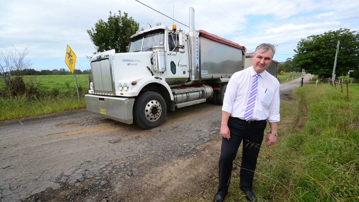 JASPERS CRUSH: Councillor Andrew Guile points out the deteriorating state of Jaspers Brush Road and wants council to either fix it or get the owner of the local airfield to do it.