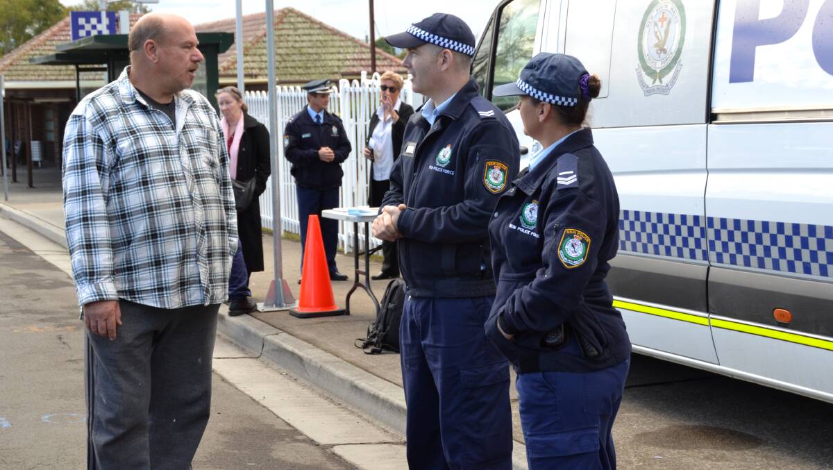COMMUNICATION: Bomaderry resident Bert Waldmann speaks with Nowra Police Senior Constables Duade Paton and Kelly Arnold during Friday morning’s meet-and-greet session. 