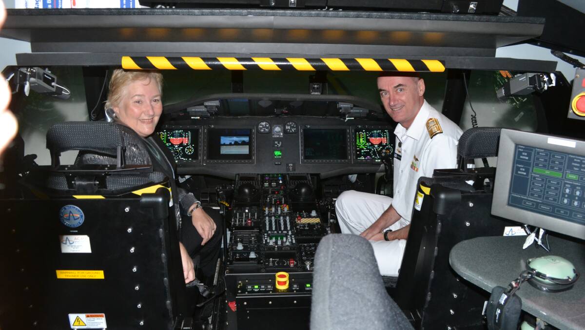 VIRTUAL: Gilmore MP Ann Sudmalis and head of the Defence Materiel Organisation’s Helicopter System Rear Admiral Tony Dalton in the Romeo flight simulator at HMAS Albatross.