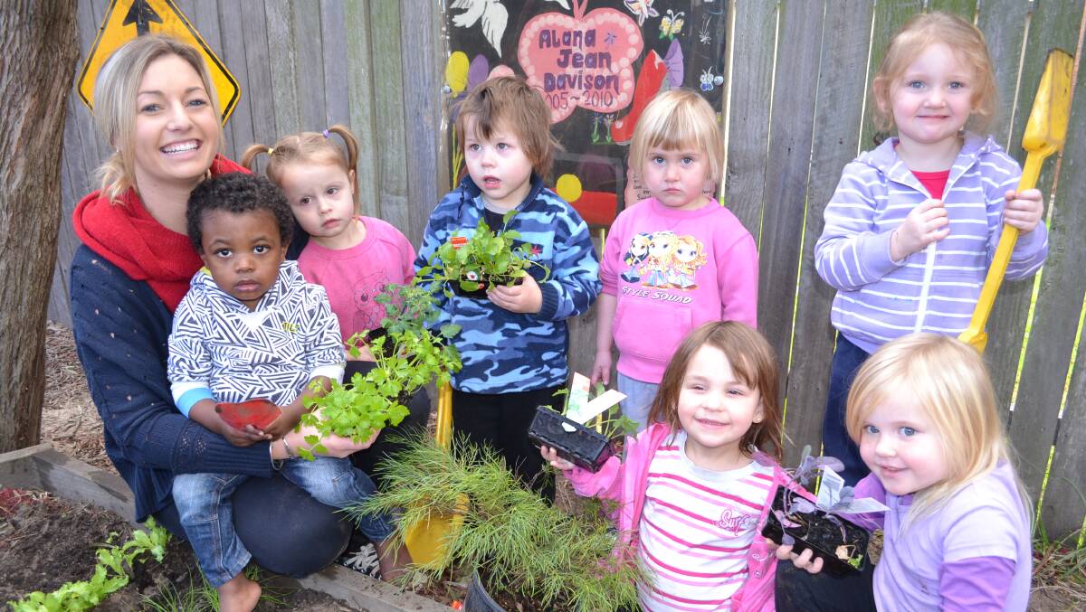 NATURE LOVERS: Clipper Road Children’s Centre educator Jade Herron plants trees and vegetables with Nnamdi Onyeajum, Peyton and Parker Manning-Jones, Payton Stringer, Sarelle Hunter, Katie-Lee Back and Bridgette Fleming for National Tree Day on Friday.