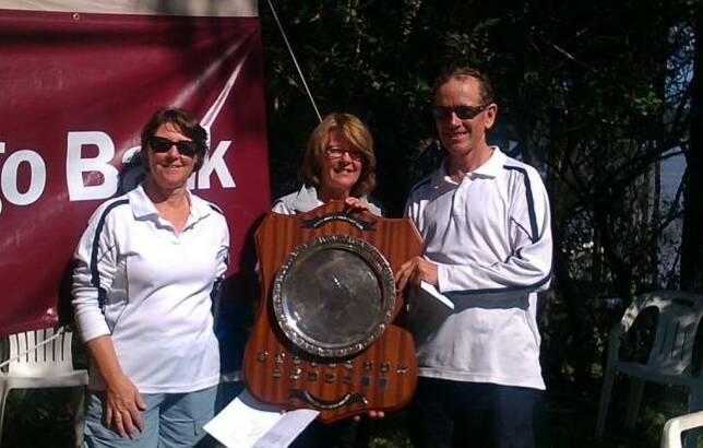 SHIELDED: Rhonda and Greg Brown receive the Timpenny Shield from vice commodore Lynne Arnold (centre).