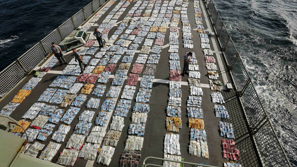 HIGH SEAS: The helicopter flight deck of HMAS Toowoomba covered with cannabis following a $280 million drug haul off the coast of Africa.