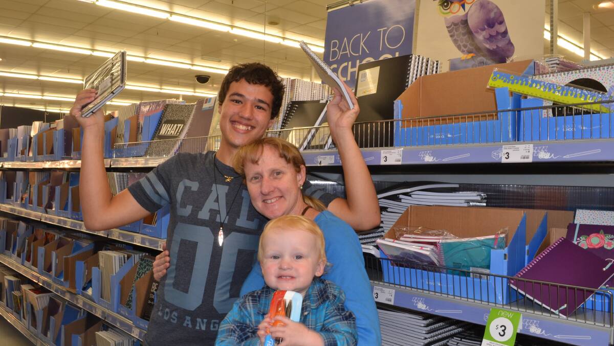 EXPENSIVE EXERCISE: Jayson, Anna and Dane Gardner from Callala Bay hunt school specials at Kmart. 