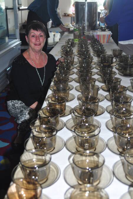 TEA FOR ALL: Barbara Bryant from the St Georges Basin Country Club’s Women’s Auxiliary, gets ready to do some serious pouring at the Bay and Basin Cancer Support group’s Australia’s Biggest Morning Tea.