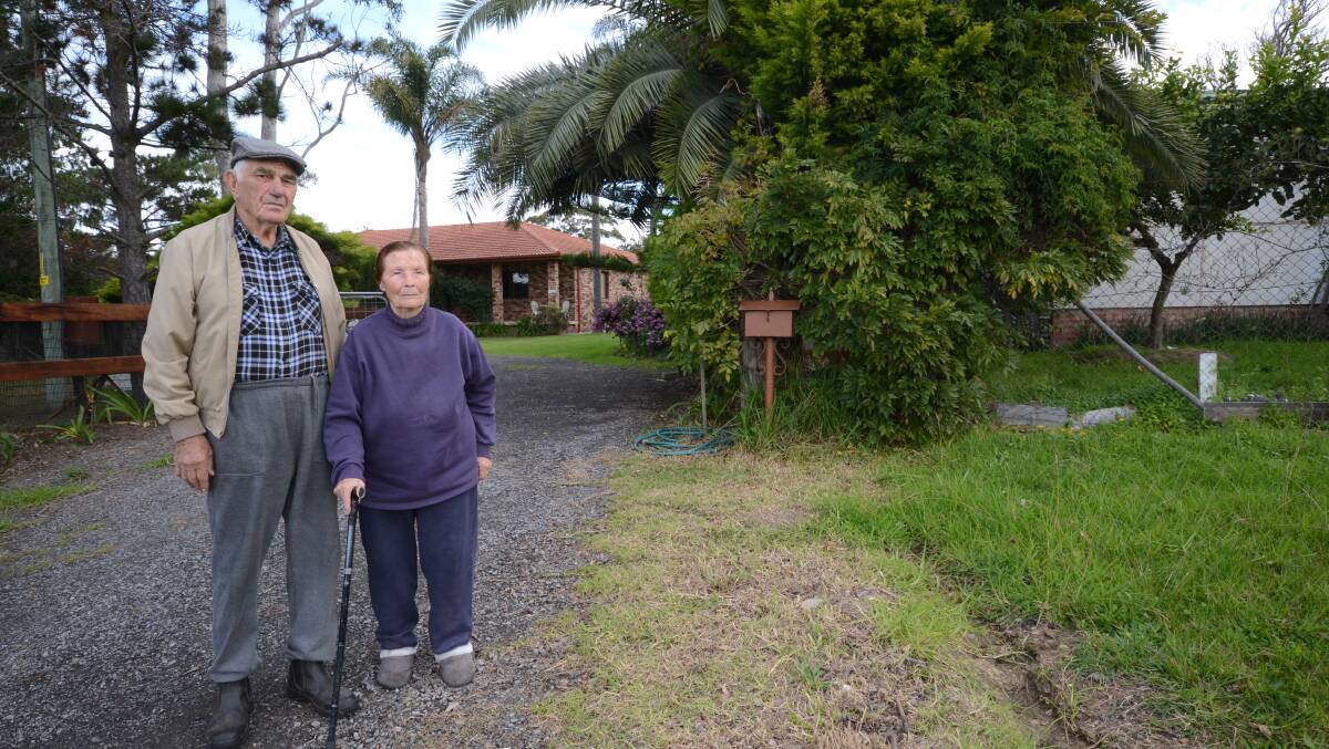 GROWING PAINS: Con and EkatIrini Nicolopoulos are worried about the impact an 80 room motel will have on the other side of their fence at Worrowing Heights.