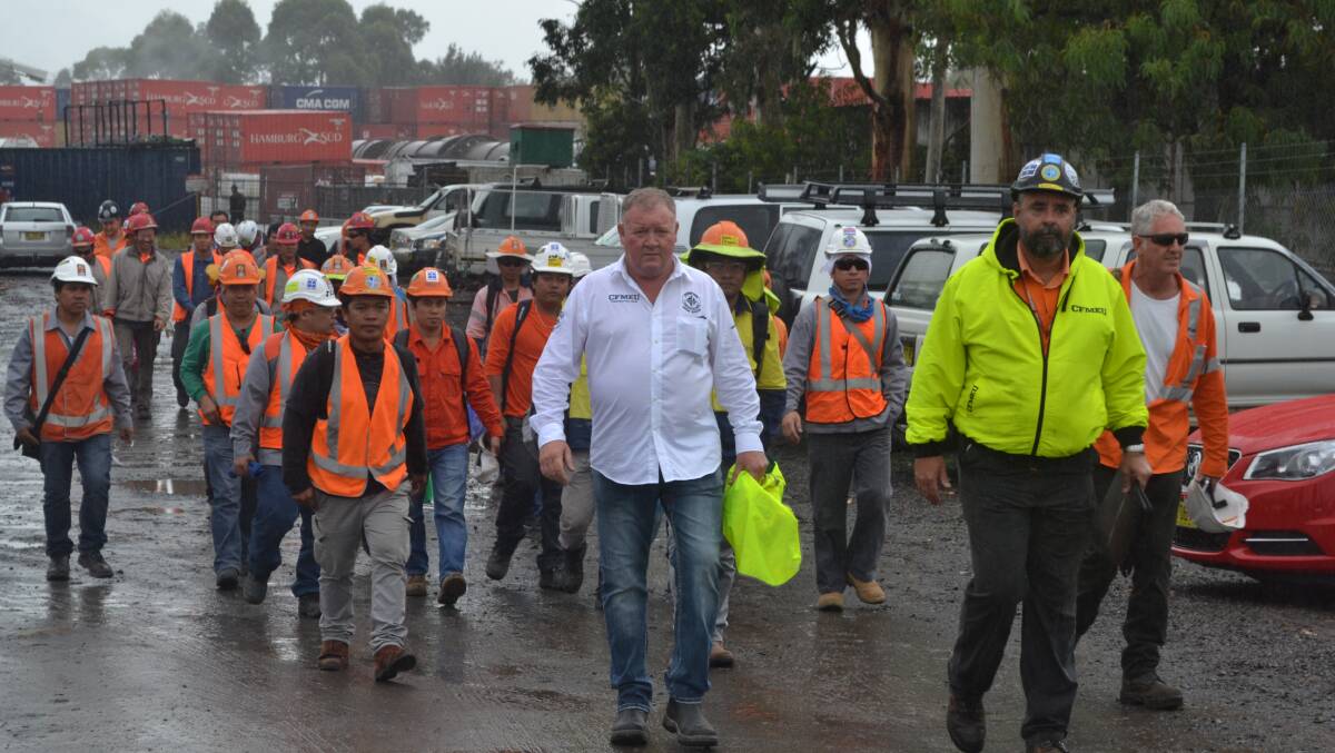 UNION SUPPORT: Overseas workers leave Manildra’s Bomaderry site with CFMEU state secretary Brian Parker, Dave Curtain and Dave Kelly.