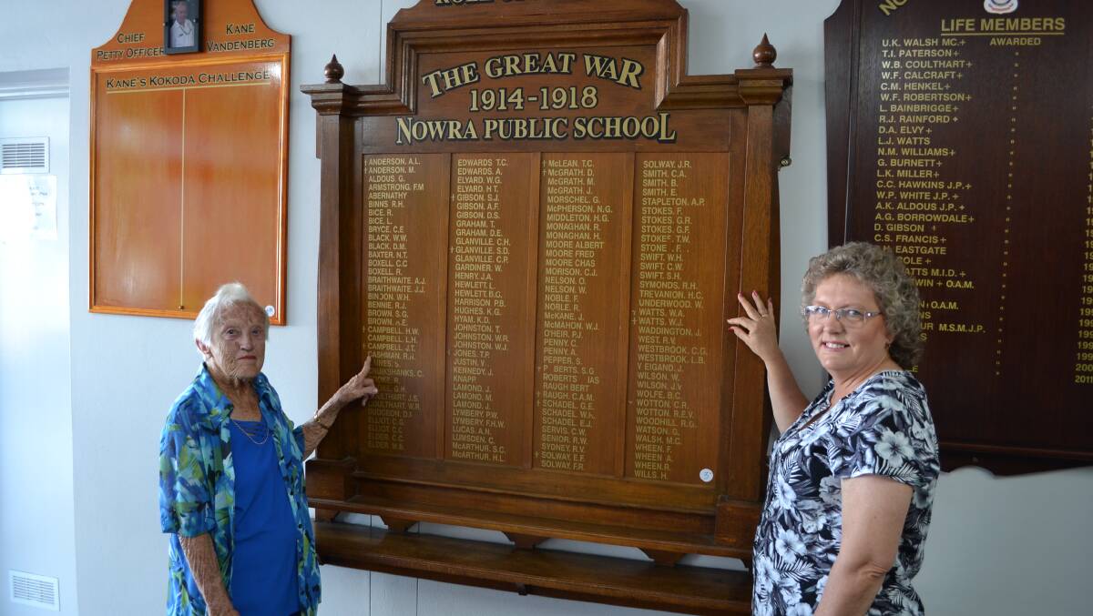 HONOUR: The only living relative of one of the original Waratahs, Norma Irwin and Nowra Public School teacher Sharon Mathieson view the school’s original honour board, with Mrs Irwin’s father’s name inscribed, that will be replicated to hang at the school for the Anzac centenary celebrations.