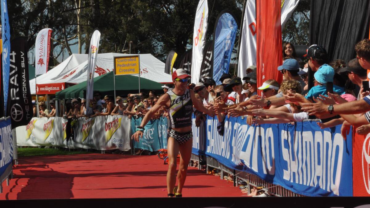 MR POPULAR: Popular Lord Howe Islander Tim Reed takes out the 2013 Huskisson Triathlon.  Photo: EMILY DALE