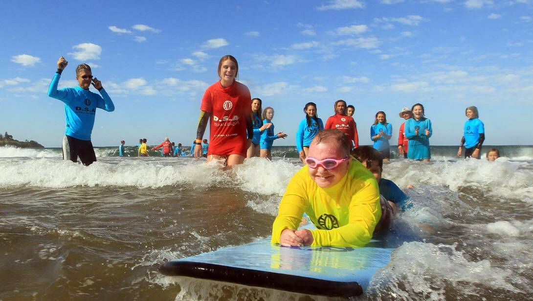 SPLASH OUT: Disabled surfers enjoyed a day in the surf at Gerroa on Sunday.    