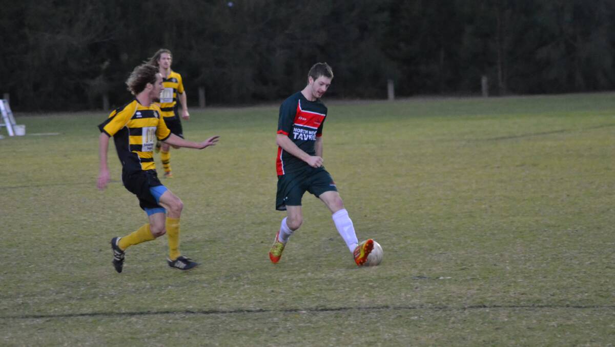 REDEMPTION: Bomaderry’s Mitch Cornell keeps an eye on Brendan Thorpe from Illaroo during Bomaderry’s 4-nil win on Saturday. Photo: PATRICK FAHY 