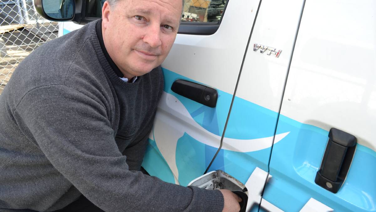 LOCAL SUPPORT: Hanlon windows owner Chance Hanlon says despite high fuel prices he tries to fuel his vehicles with a local fuel company to benefit the community.