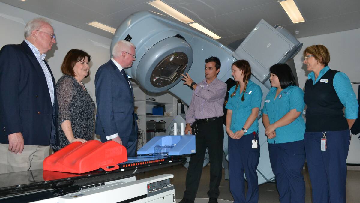 FLASHBACK: Prior to the state election in March South Coast MP Shelley Hancock and Kiama MP Gareth Ward announced the government would commit to $5 million for a second linear accelerator at the Shoalhaven Cancer Care Centre. Director of Cancer Services Illawarra Shoalhaven, Anthony Arnold, radiation therapists Chelsea Smith and Amelia Wan and radiation therapy site manager Marianne Rinks explained the workings of a linear accelerator to (left) founding president of the Nowra Linear Accelerator Fundraising Committee, Paul Dean, Mrs Hancock and Mr Ward.