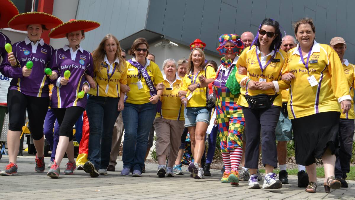 FEET FIRST: Some of the Relay for Life’s more than 1300 participants walk to raise money for cancer research.