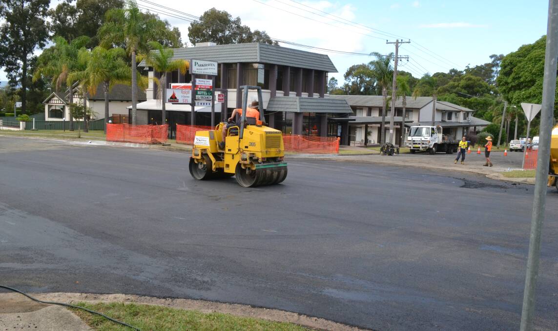 SMOOTH OPERATORS: Shoalhaven City Council contractors rehabilitate the road surface at the intersection of Kinghorne and Douglas streets ahead of the construction of a roundabout.