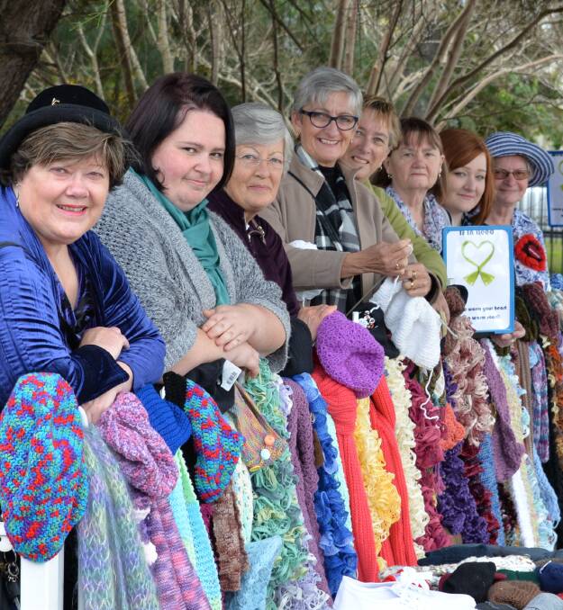 WINTER WOOLIES: Narrell Brown from Sanctuary Point, Sarah Pride from Bomaderry, Mary Rose from Nowra, Robyn McEwan from Berry, Carol Armstrong from Bangalee, Barbara Zylstra from Nowra, Sarah Anderson from Nowra and Margaret Knowles from Nowra brighten up winter with the Let’s Yarn Bomb Nowra project.