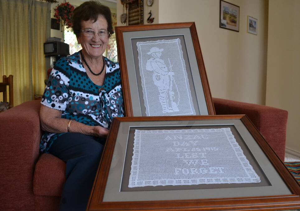 ANZAC MEMORIBILIA: Joy Gibson with the two crotchet works by her grandmother Annie Clarke commemorating Anzac Day, which will be part of the Shoalhaven Historical Society’s Centenary of Anzac exhibition. 