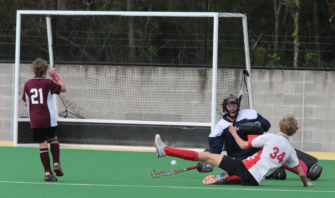 SAVED: Kangaroo Valley’s Nick Crawford slides in to save a St Georges Basin goal.
