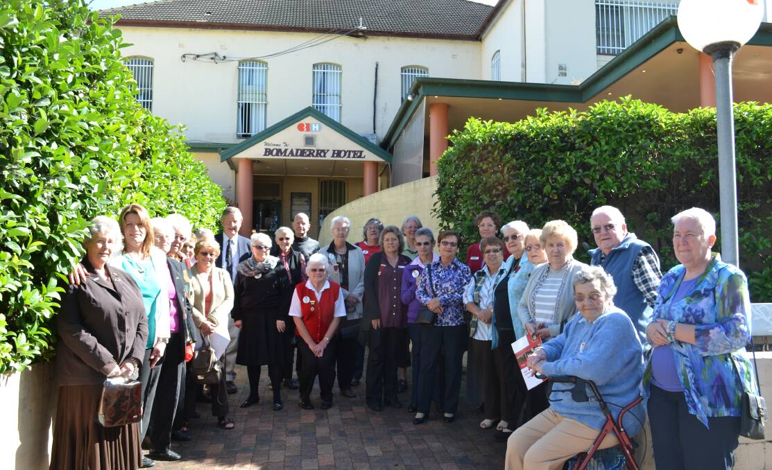 BIG DAY: Volunteers and members gather at the Bomaderry Hotel, formerly a convalescent home for soldiers returning from World War I, to mark World Red Cross Day. 