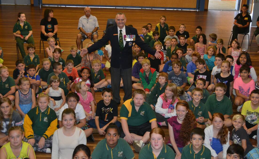 STANDING TALL: Proud Australian and Victoria Cross recipient Keith Payne stands among Nowra East Public School students, who he says are the future of the nation.