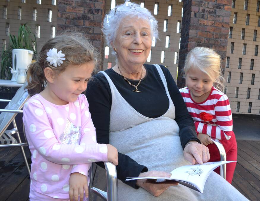 BELLY LAUGH: Jennifer Dickerson launched a book of verse at the Shoalhaven City Arts Centre on Tuesday with the help of two of her grandchildren, Sasha and Ruby Dickerson.