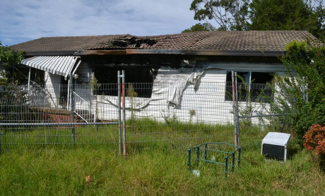 EYESORE: Residents have called for a home at 104 Jervis Street, Nowra, damaged by fire in May 2013, to be demolished.
