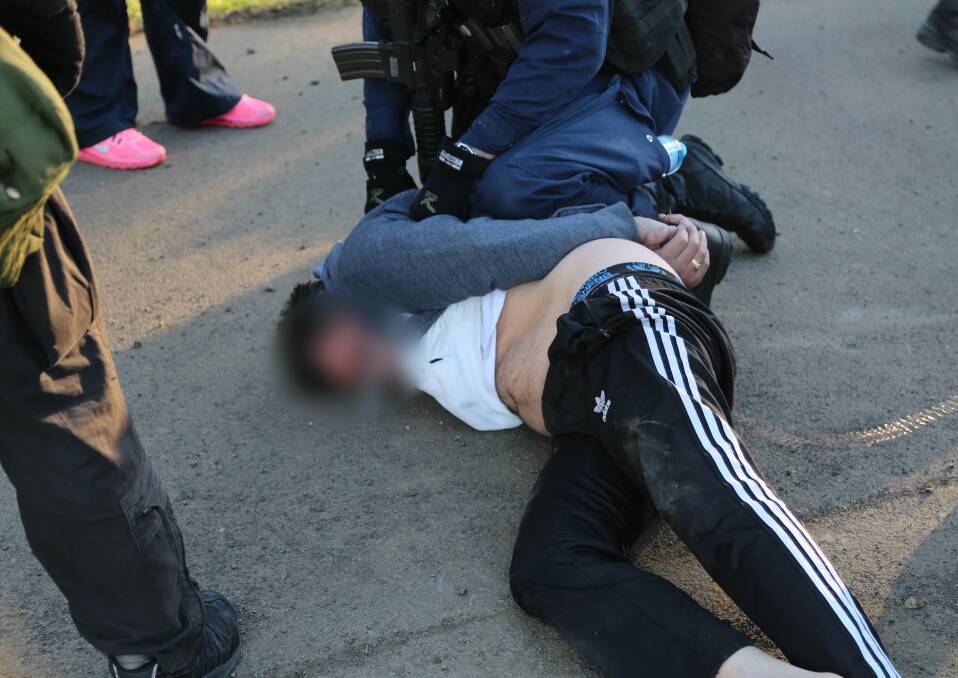 TAKEDOWN: A man is arrested in Berry during the co-ordinated ice raids conducted as part of the ongoing Operation Croci.