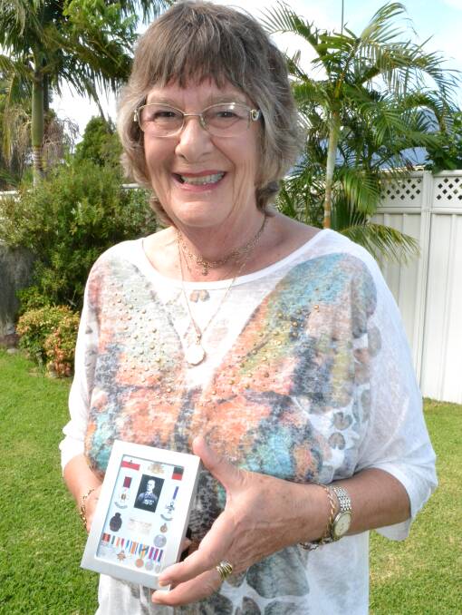 PROUD: Anne-Louise O’Connor from Shoalhaven Heads proudly holds a photograph of her grandfather, Charles Traill. 