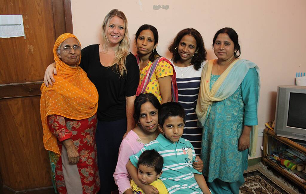 SCHOOL OF THOUGHT: Former Shoalhaven Heads woman Alicia Isles with sisters Yashi, Saba, Toshi and Adibaba and their mother Iqbal and two students from the Angels World Academy school.