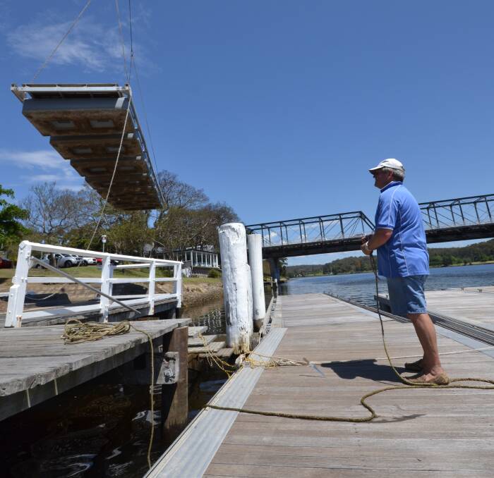 INSTANT ISLAND: Marina designer and project manager Terry Chittleborough guides in another giant pontoon to build the Shoalhaven River Festival Marine Expo.