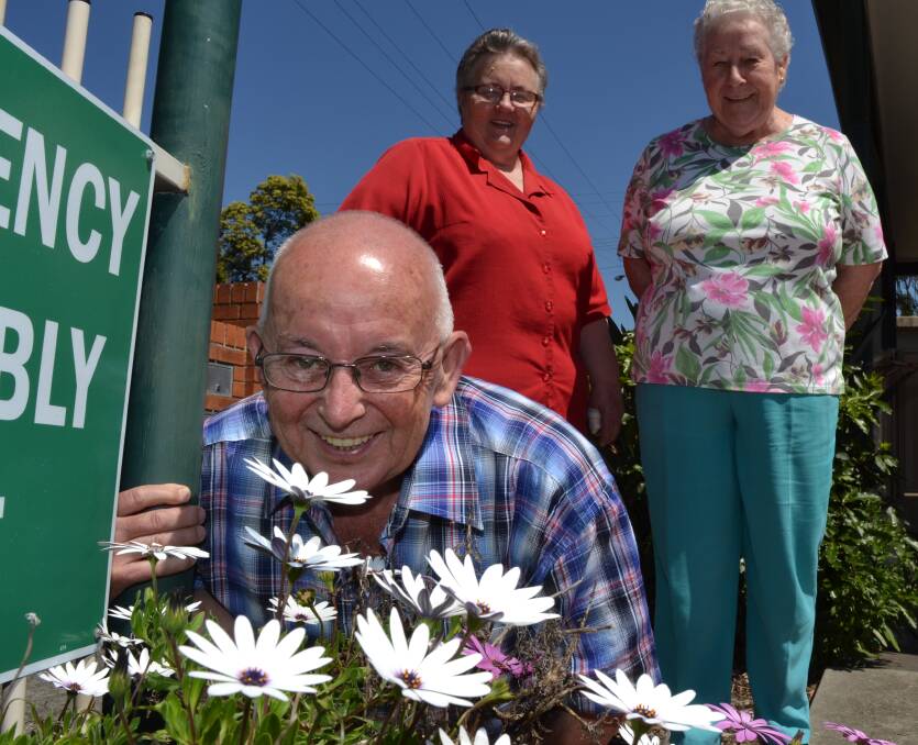 CALL FOR HELP: Nowra residents Reg Newsome, Judy Taylor and Shirley Newsome hope more people volunteer with Yard Assist to help the service grow.  
