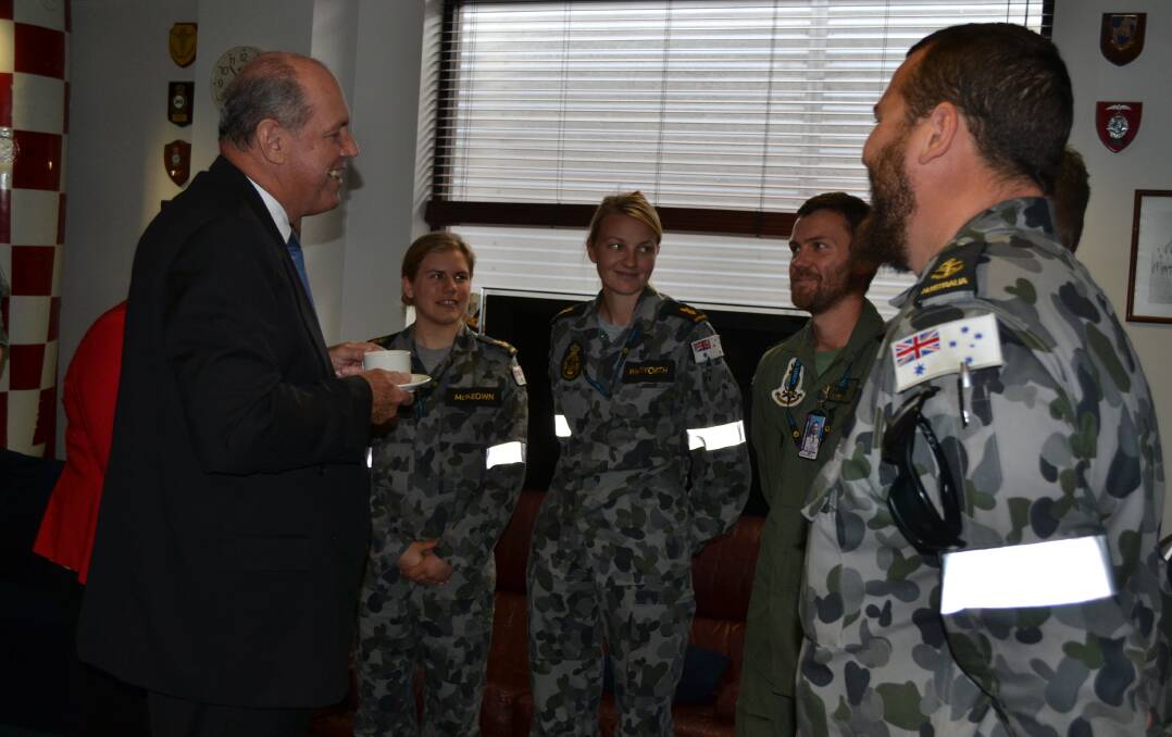 TAKE-OFF: Defence Minister David Johnston meets HMAS Albatross personnel during his visit to the base on Thursday during which he announced a $700 million Helicopter Aircrew Training System would be based at the Nowra naval air station.