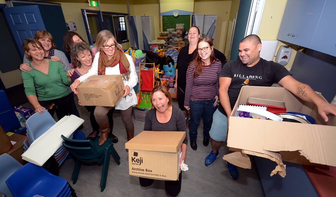 TEAMWORK: Leanne Ryan, Sue Redman, Alice Lans, Lynn Burns, Deb Jones, Cindy Griffiths, Lisa Courtney, Belinda Zammit and Charlie Ashby pitch in to help Noah’s Shoalhaven pack up to move.