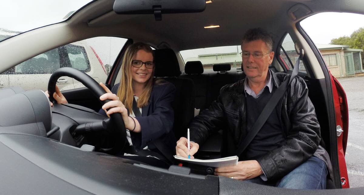 TIME IS MONEY: Grace King prepares to log another three hours of supervised driving with driving instructor Peter Dryer.