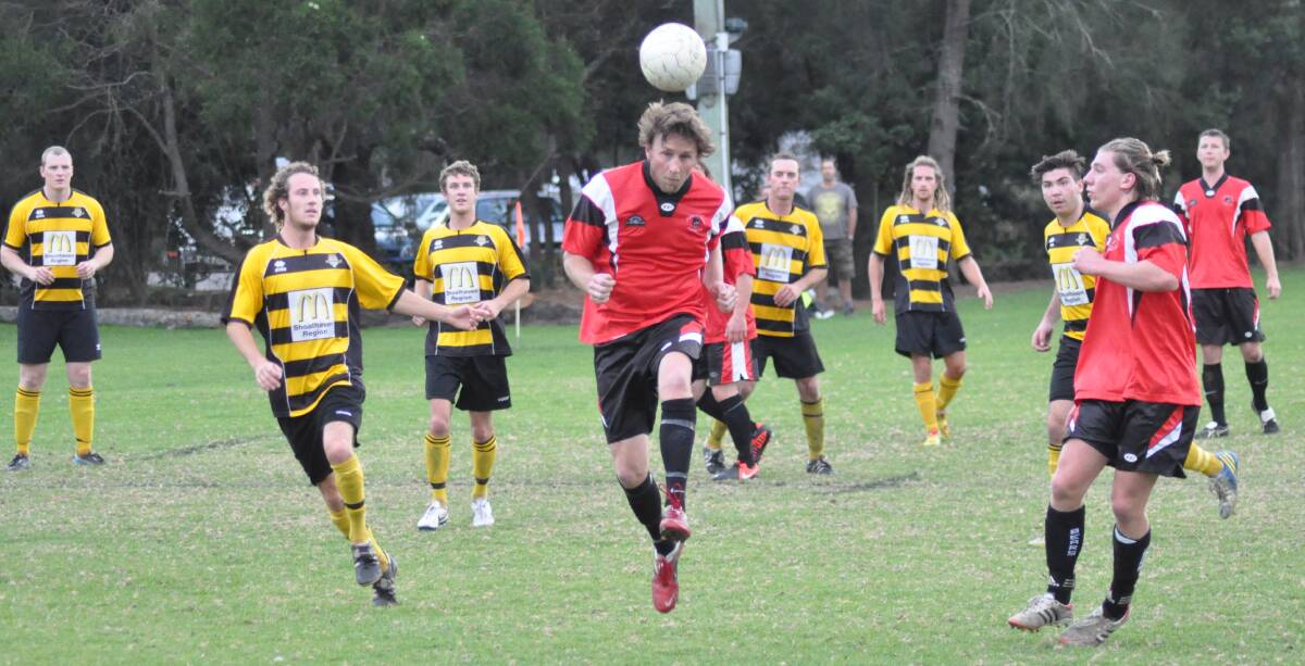 HEADER: Shoalhaven United’s Matt Fuz heads a ball down the field during his team’s 4-2 win over Bomaderry on Saturday. 	Photo: PATRICK FAHY