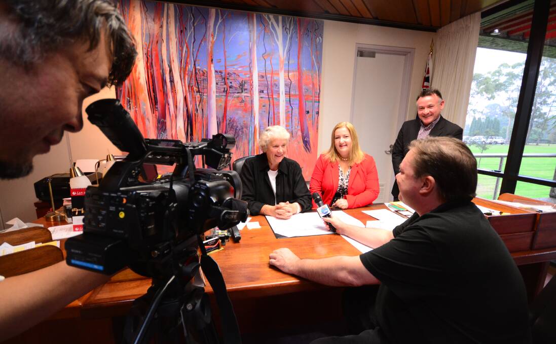 HELLO CHINA: Shoalhaven Mayor Joanna Gash, chairperson of the Shoalhaven Tourism Board Catherine Shields and council’s tourism manager Steve Lawson take part in a Chinese television interview about the Shaolin Temple.