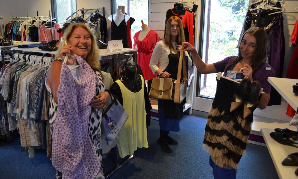 DRESS UP: St Vincent de Paul promotions co-ordinator Lee Hughes and volunteers Shannon Koletti and Rebecca Kamm find frocks to dress up for the annual Winter Appeal Gala Ball next month.