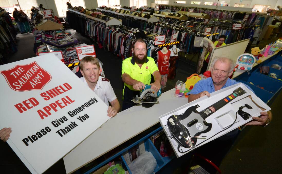 HALF PRICE SALE: Salvation Army lieutenant Dominic Wallis and Salvation Army Nowra store workers Glen White and Kelvin Bowers are prepared to sell everything in the store at half price on Tuesday.