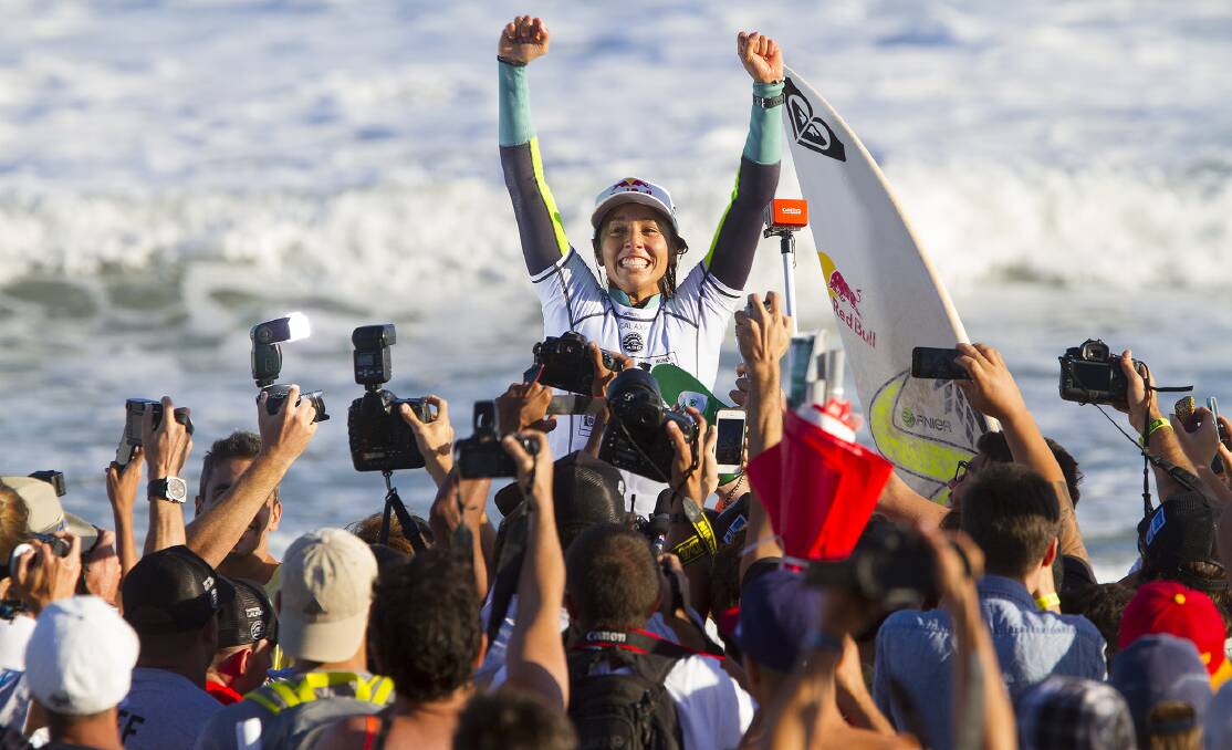 PERFECTION: Gerroa’s Sally Fitzgibbons celebrates winning the Billabong Rio Pro after she defeated world number one, Carissa Moore in the final on Monday, May 12.                            Photo: ASP/SMORIGO