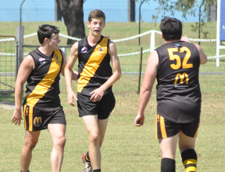 GOOD JOB: Bomaderry Tigers players Andrew Ellis, James Lees and Brayden Varcoe excelled on the field on Friday night. 	Photo: PATRICK FAHY