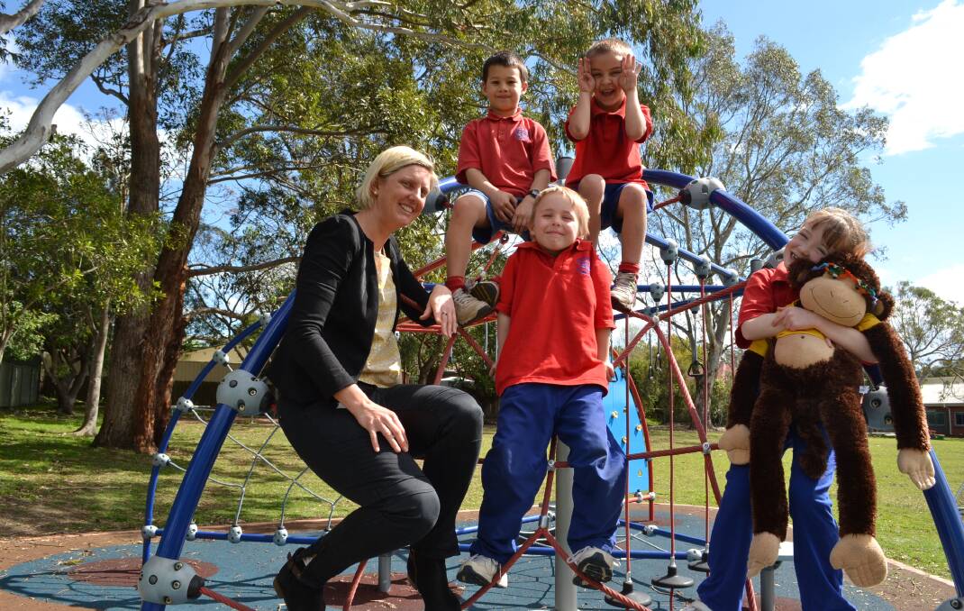 HELP: St Michael’s teacher Amanda Lloyd has been helping students Ben Le, Wil Bruce, Jye Sloane and Jennifer Stoekle to raise funds for the family of their friend Lachlan Thoroughgood, who was recently diagnosed with a brain tumour.