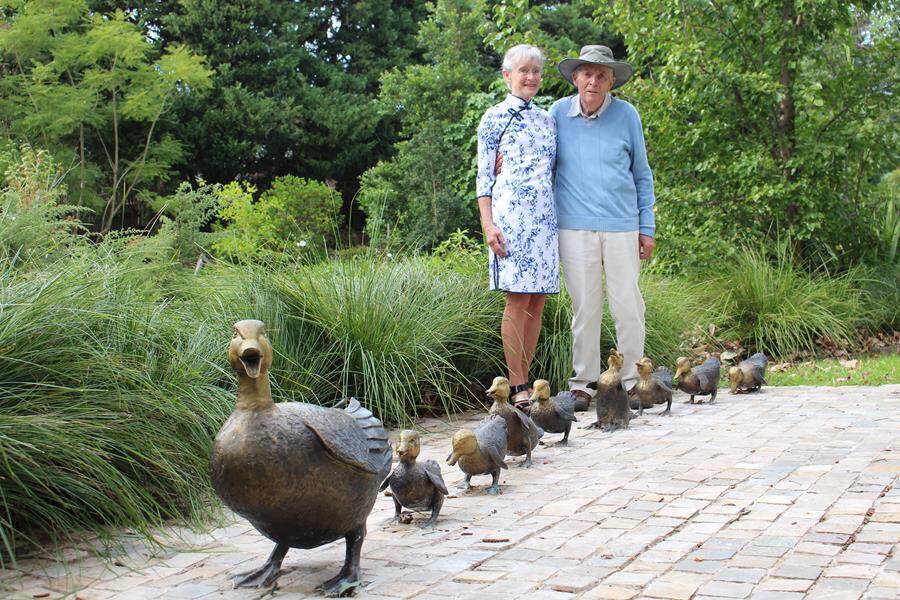 Rosmond and Robin Brooks with their recently donated a set of bronze duck sculptures. Photo: supplied. 