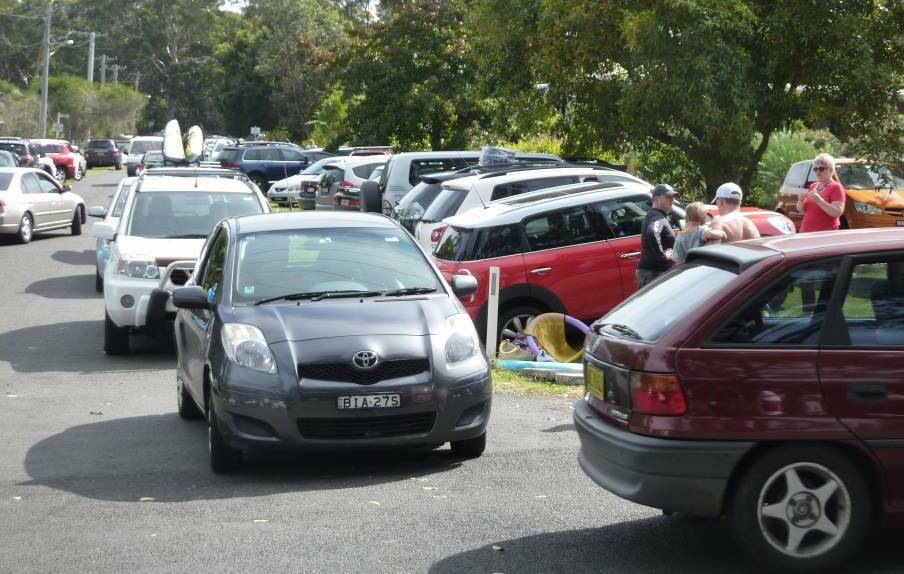 Traffic nightmare: Cars trying to navigate narrow streets near Hyams Beach and parking anywhere they can during the busy peak season. 