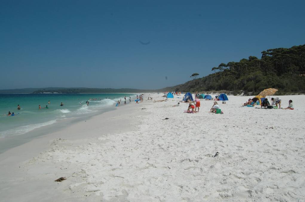 Paradise trouble: Every year thousands of tourists and visitors are drawn to the white sands of Hyams Beach but its fame has also created a traffic nightmare for the small village. 